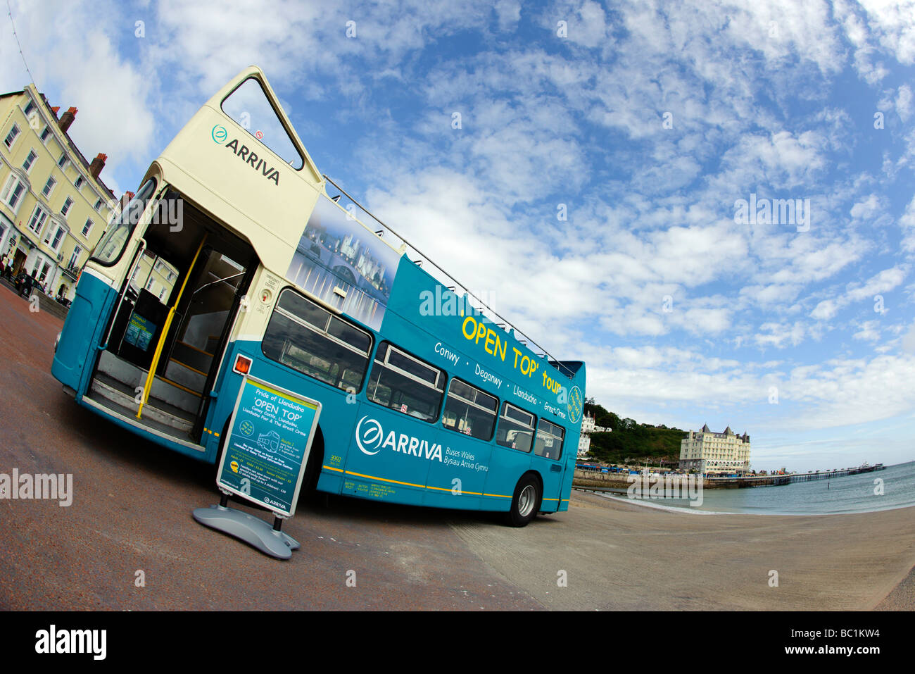 An open top bus on the seafront in Llandudno North Wales Stock Photo