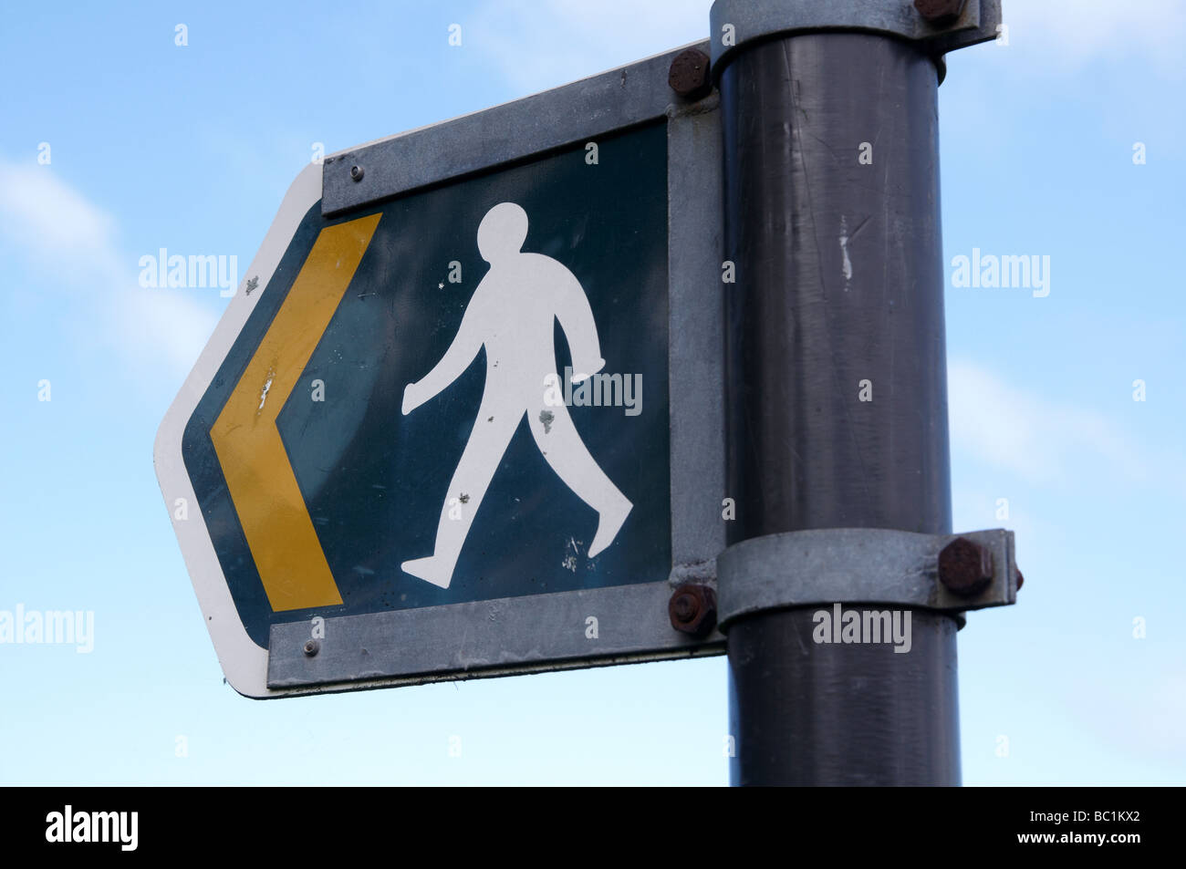 Footpath sign - white walking figure on green background Stock Photo ...
