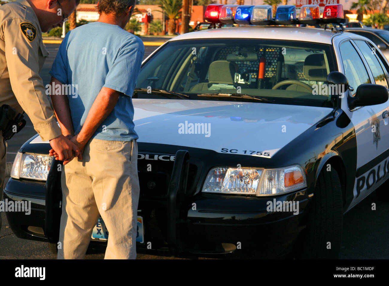 Man being arrested by a police officer in Las Vegas Nevada USA Stock Photo
