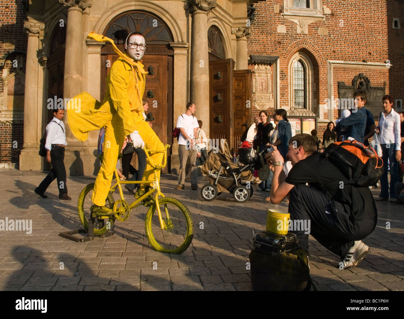 Funny street performer on bicycle at Main Market Square Krakow Poland Stock Photo