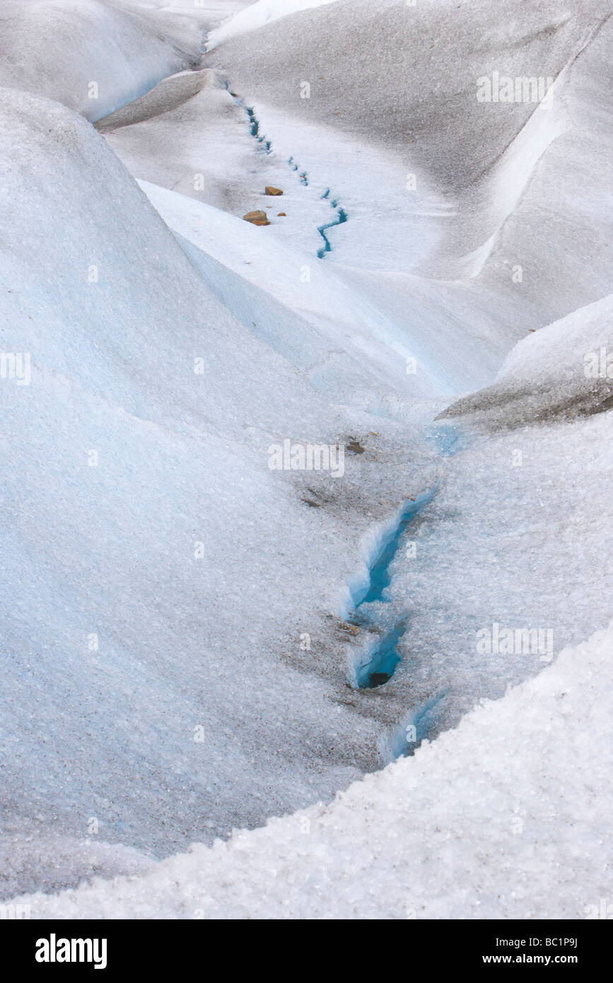 A crack in the surface ice of the Perito Moreno Glacier, in Los Glaciares National Park, Patagonia, Argentina. Stock Photo