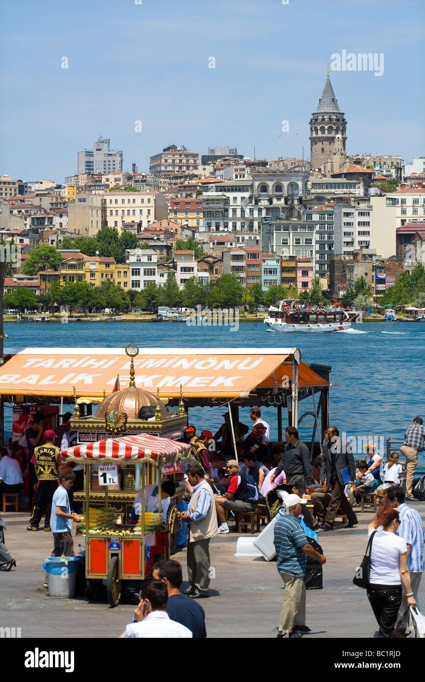 Quayside near to Eminonu with Tower of Galata across the Bosphorus Istanbul Stock Photo