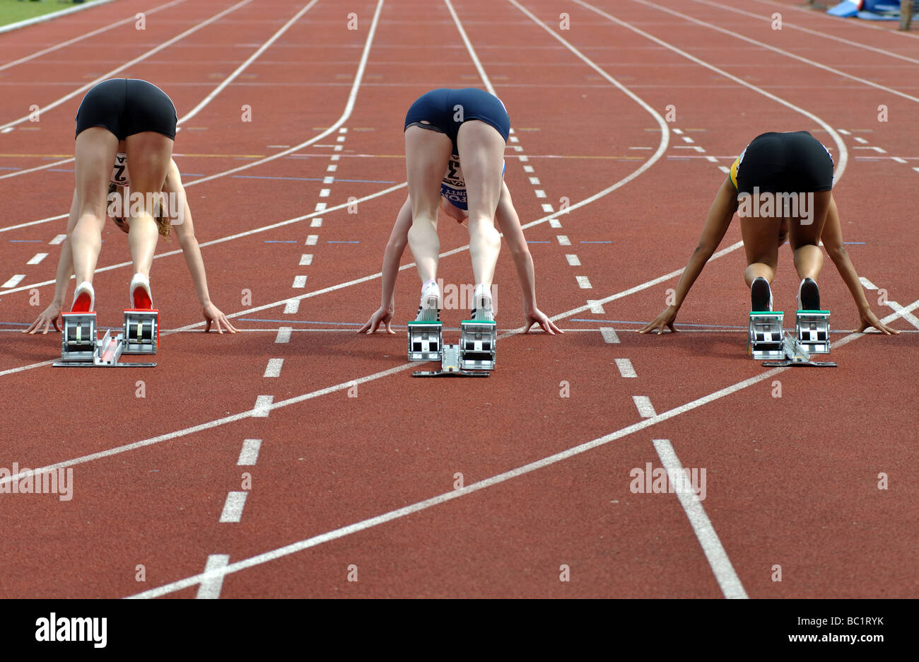 Runners in starting blocks, rear view Stock Photo Alamy