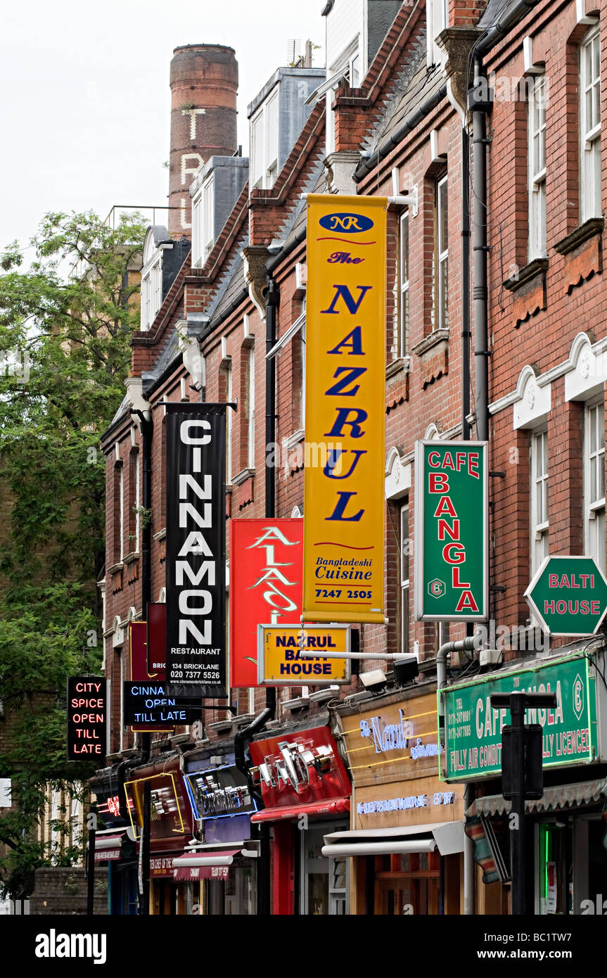 famous curry restaurant signs down brick lane in the east end of london Stock Photo