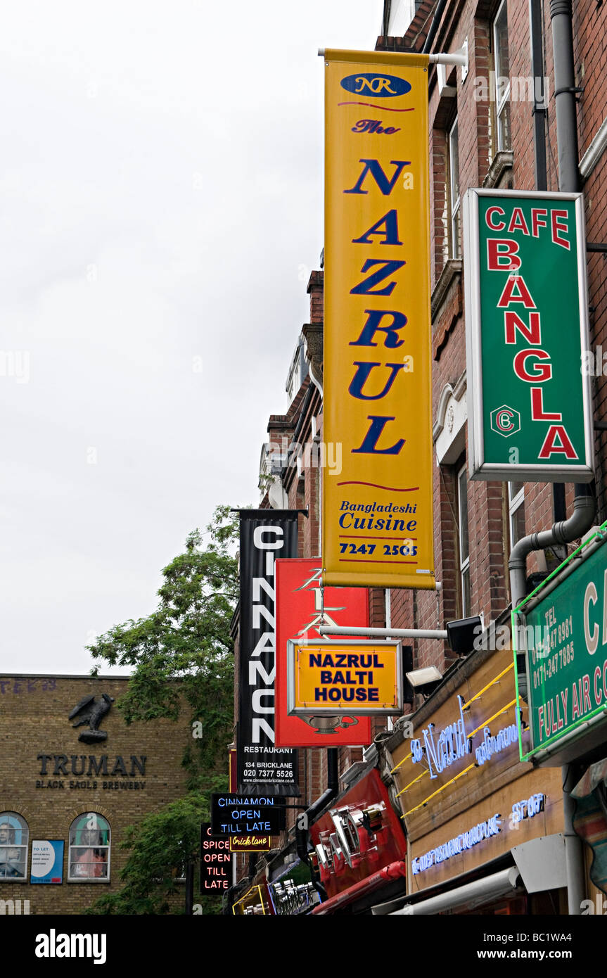 famous curry restaurant signs down brick lane in the east end of london