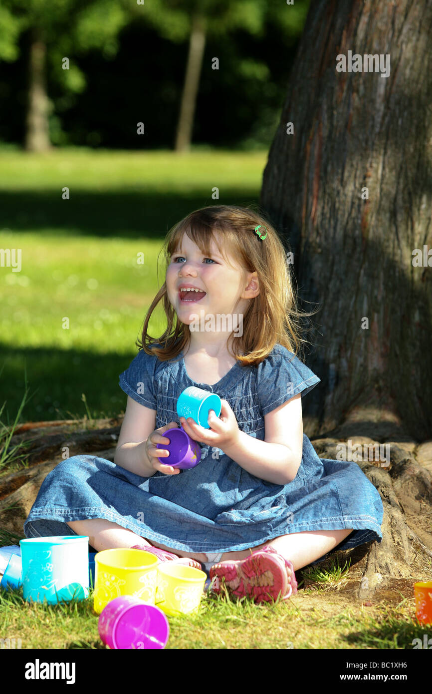 https://c8.alamy.com/comp/BC1XH6/smiling-happy-three-3-year-old-pre-school-child-toddler-playing-with-BC1XH6.jpg