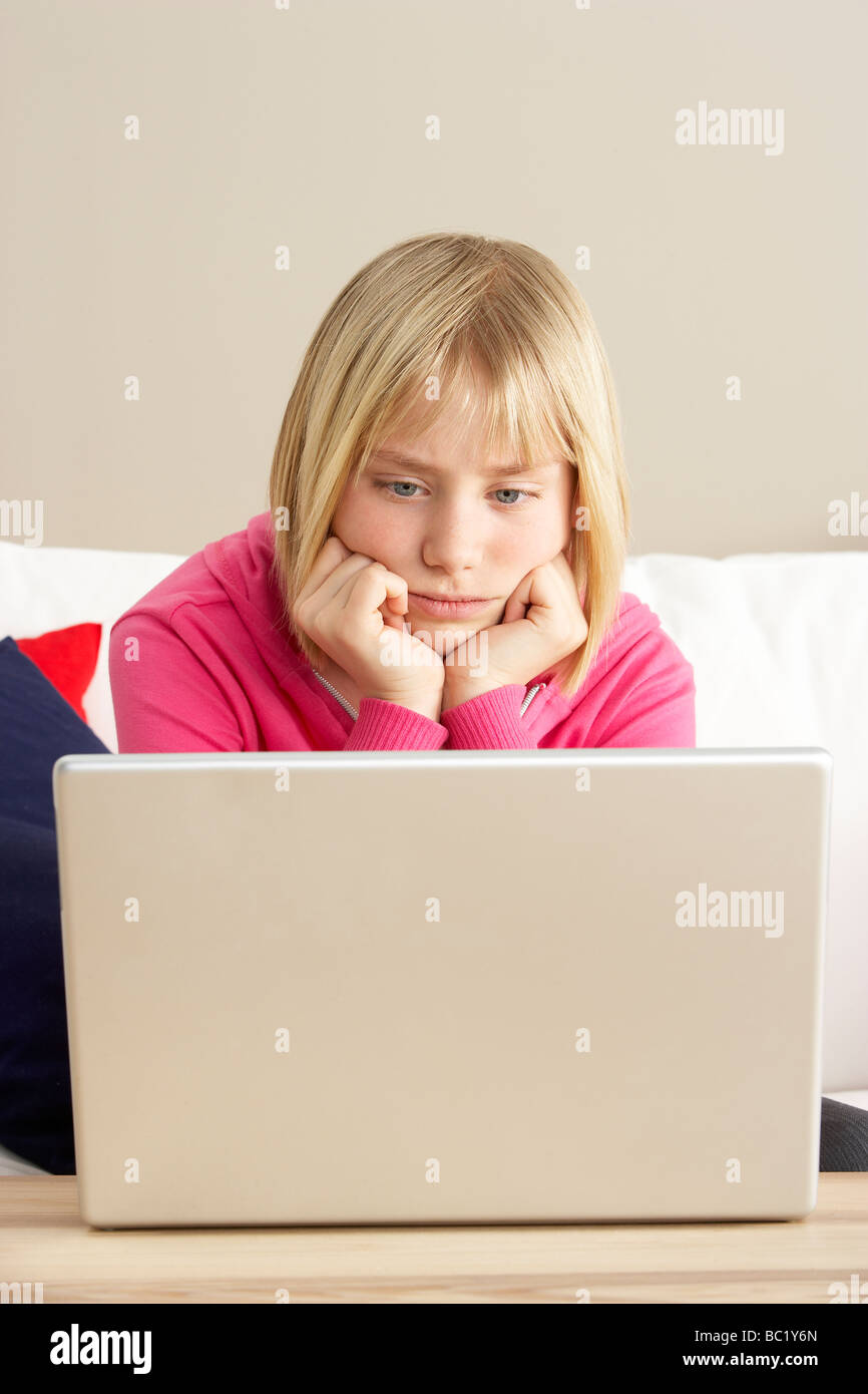 Worried Looking Girl Using Laptop Stock Photo
