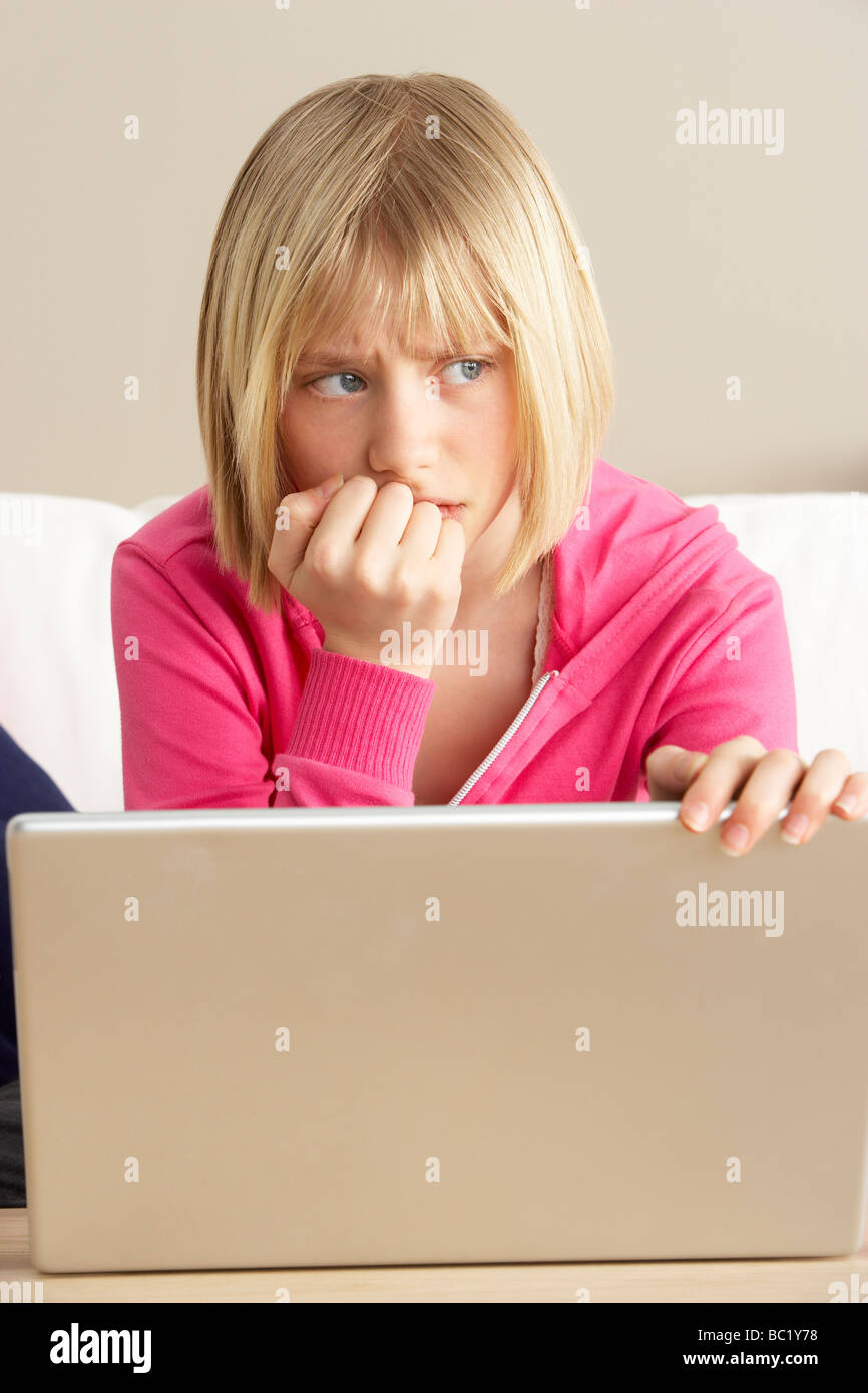 Worried Looking Girl Using Laptop Stock Photo