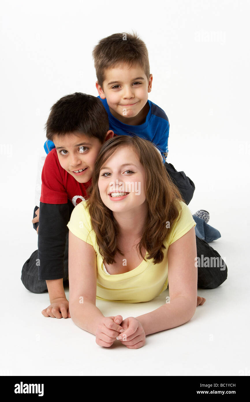 Brothers And Sister In Studio Stock Photo