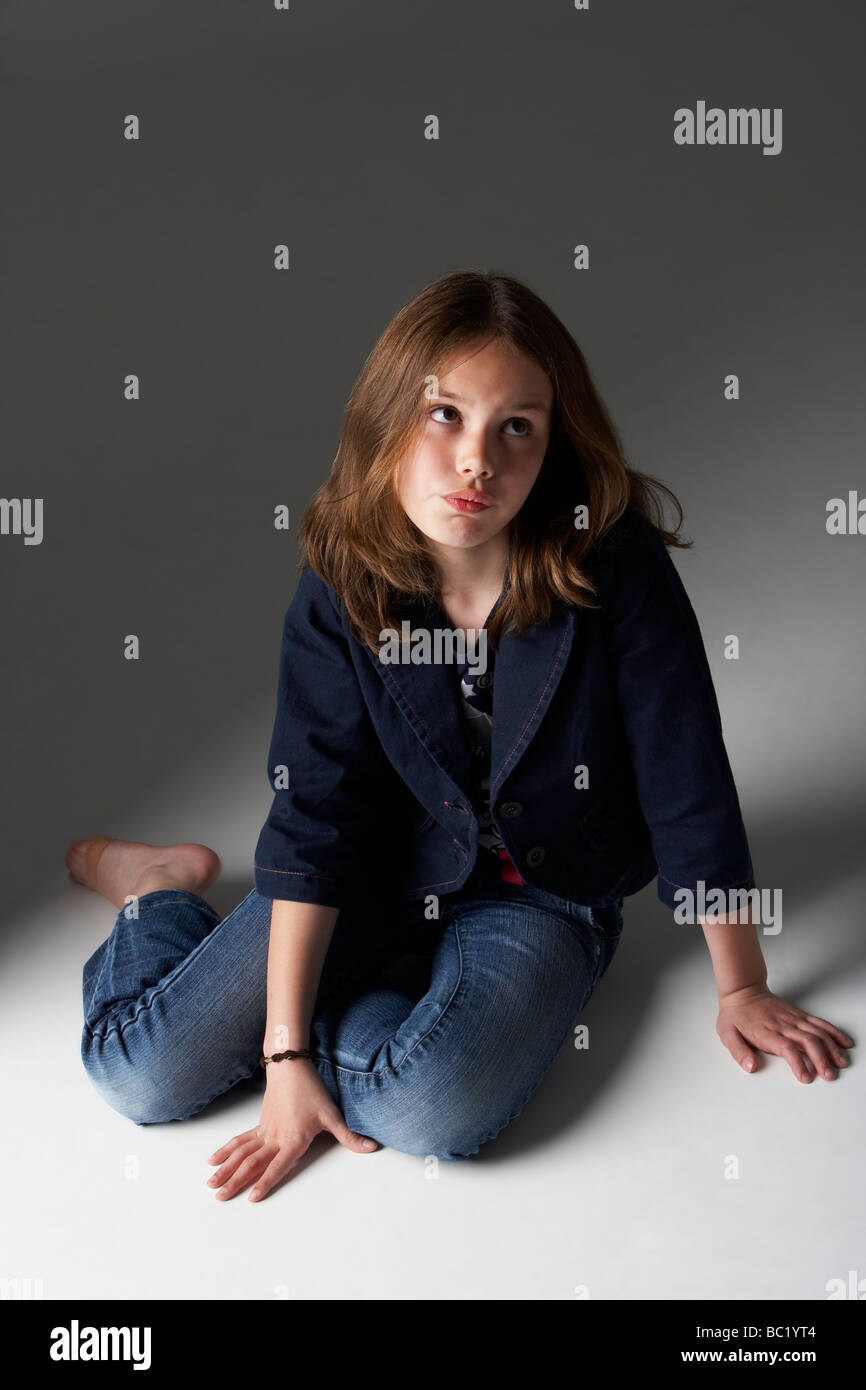 10 year old girl sitting full length hi-res stock photography and ...