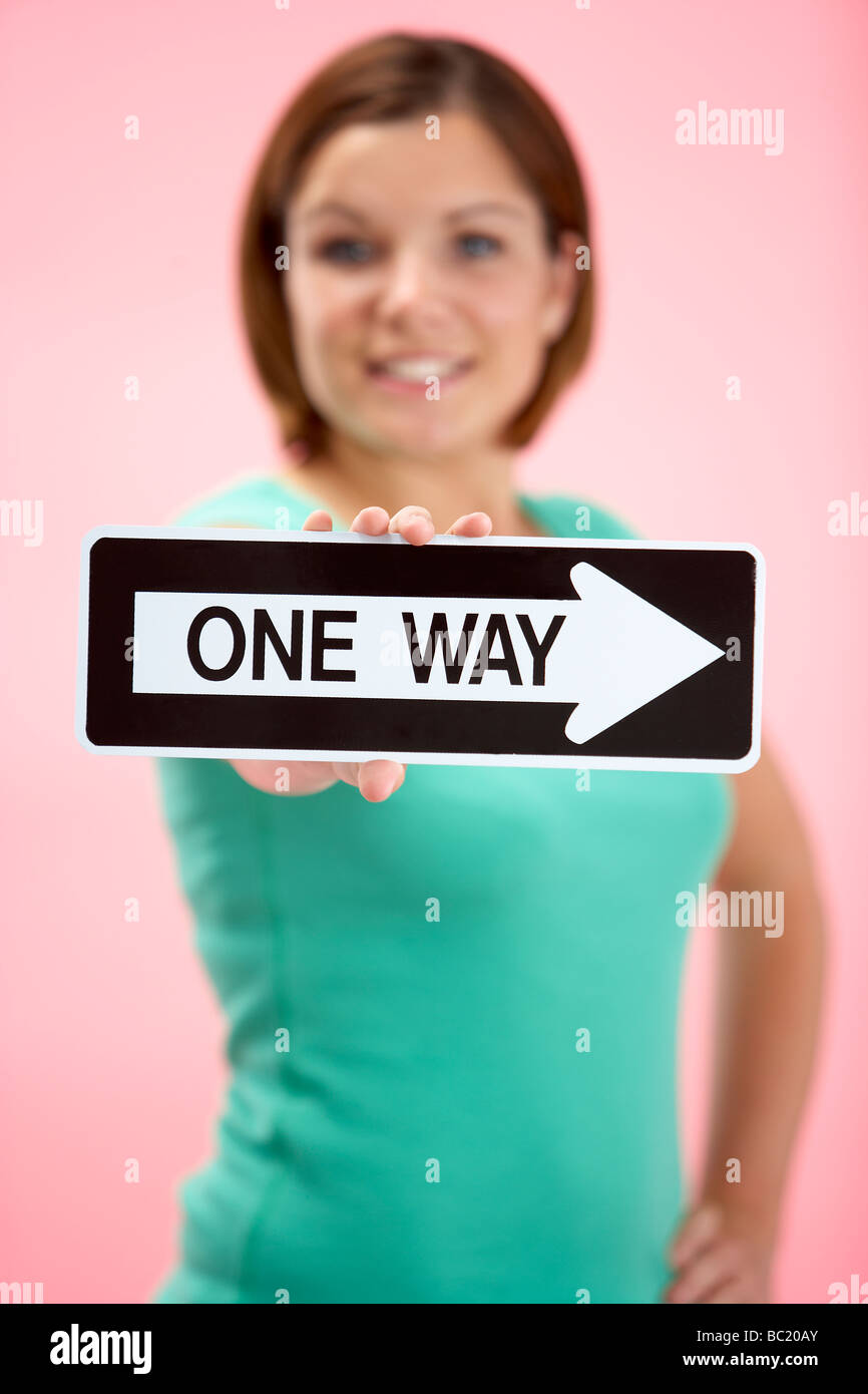Woman Holding Road Traffic Sign Stock Photo - Alamy
