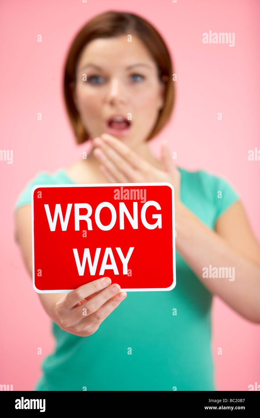 Woman Holding Road Traffic Sign Stock Photo - Alamy