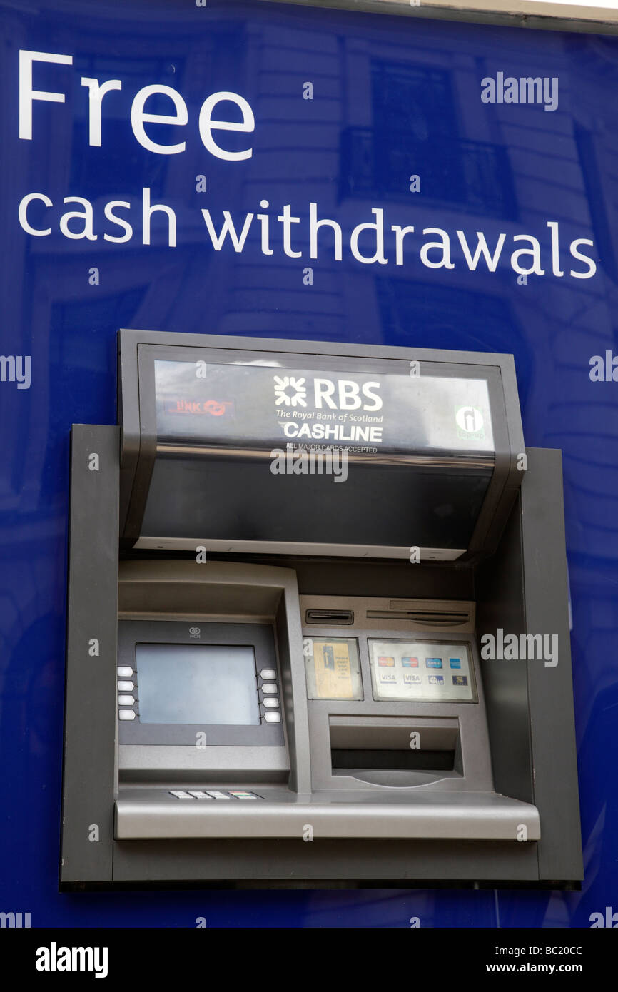 an rbs cash dispenser with a large notice free cash withdrawals colmore row birmingham uk Stock Photo