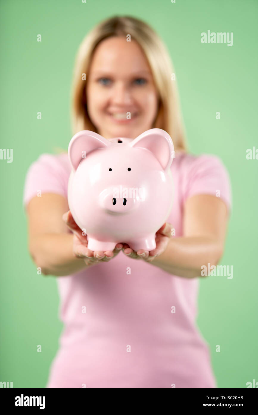 Woman Holding Piggy Bank Stock Photo - Alamy