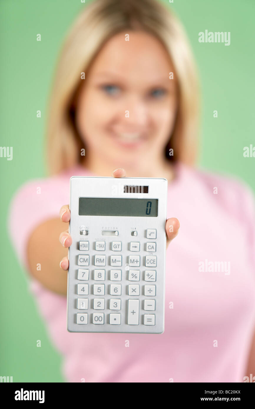Woman Holding Calculator Stock Photo Alamy