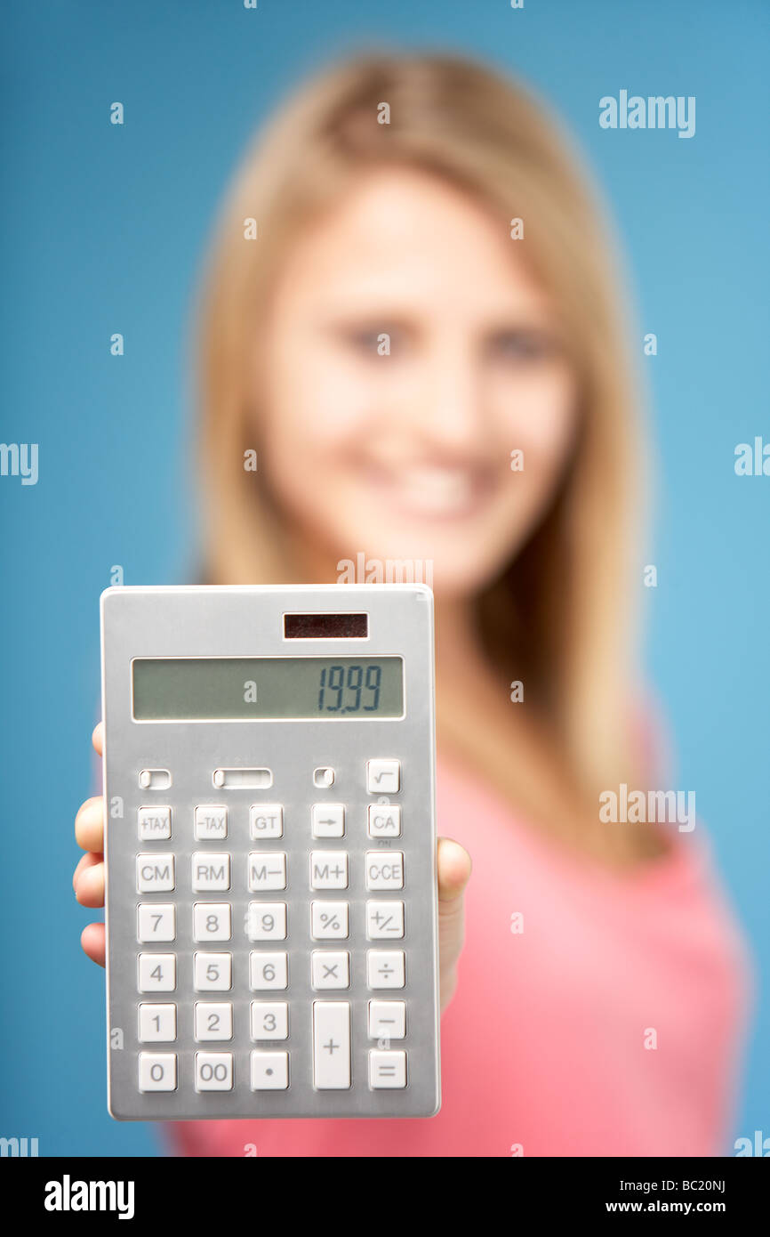 Teenage Girl Holding Calculator Stock Photo Alamy