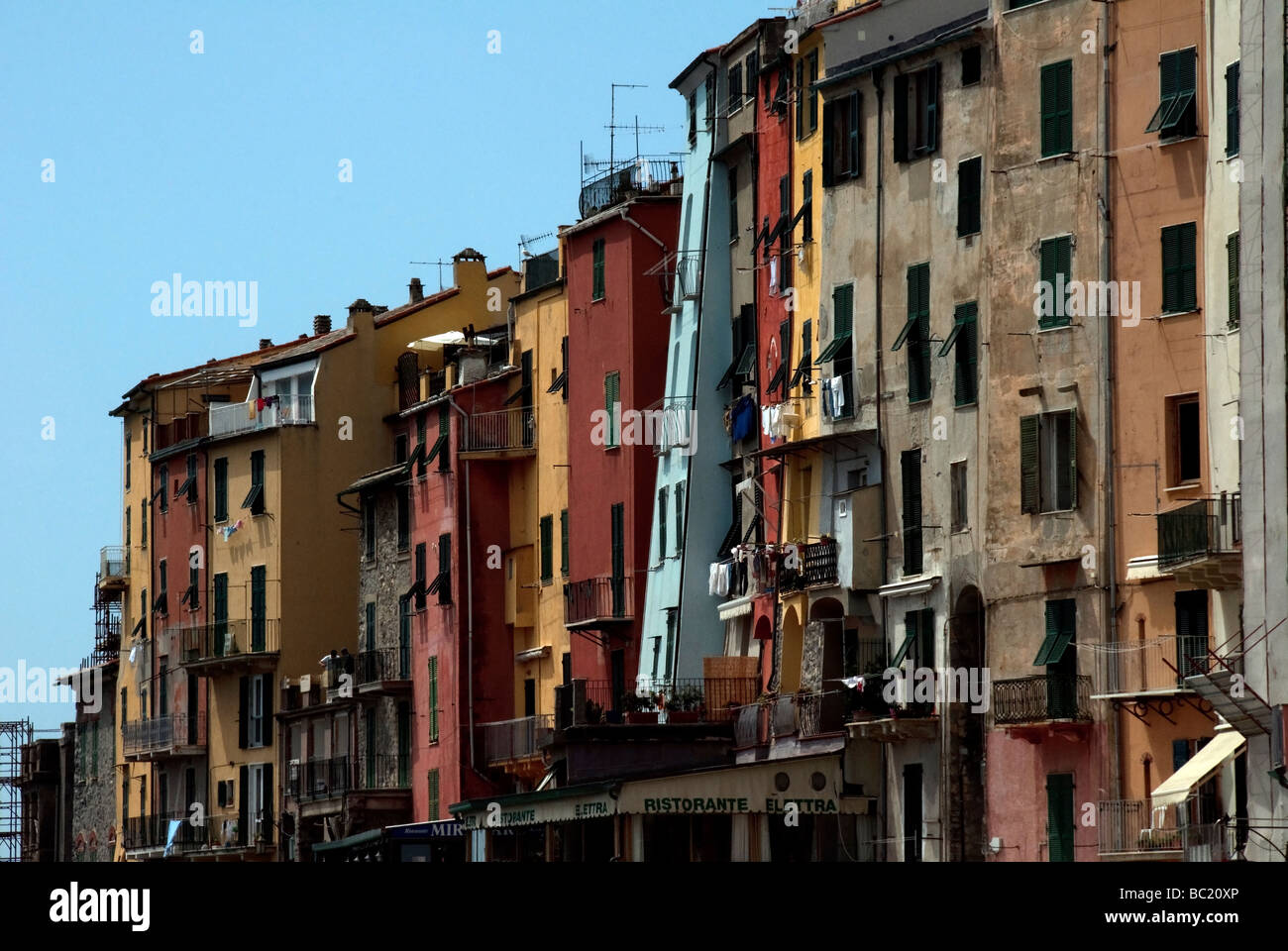 multistoried brightly coloured harbourside buildings dating from the medieval period in Portovenere Stock Photo