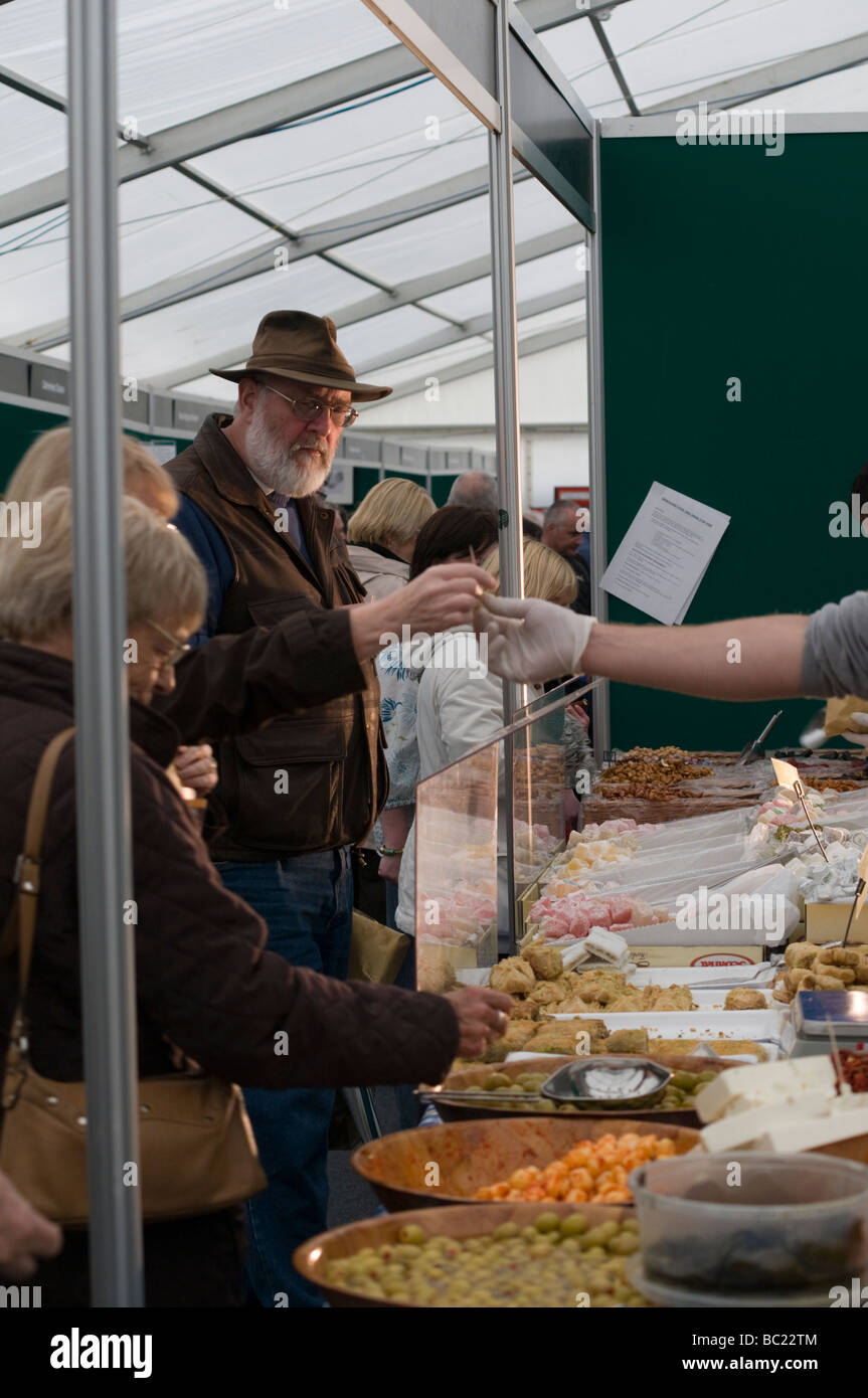 Crowds of people looking at Displays of produce at a Food and Drinks