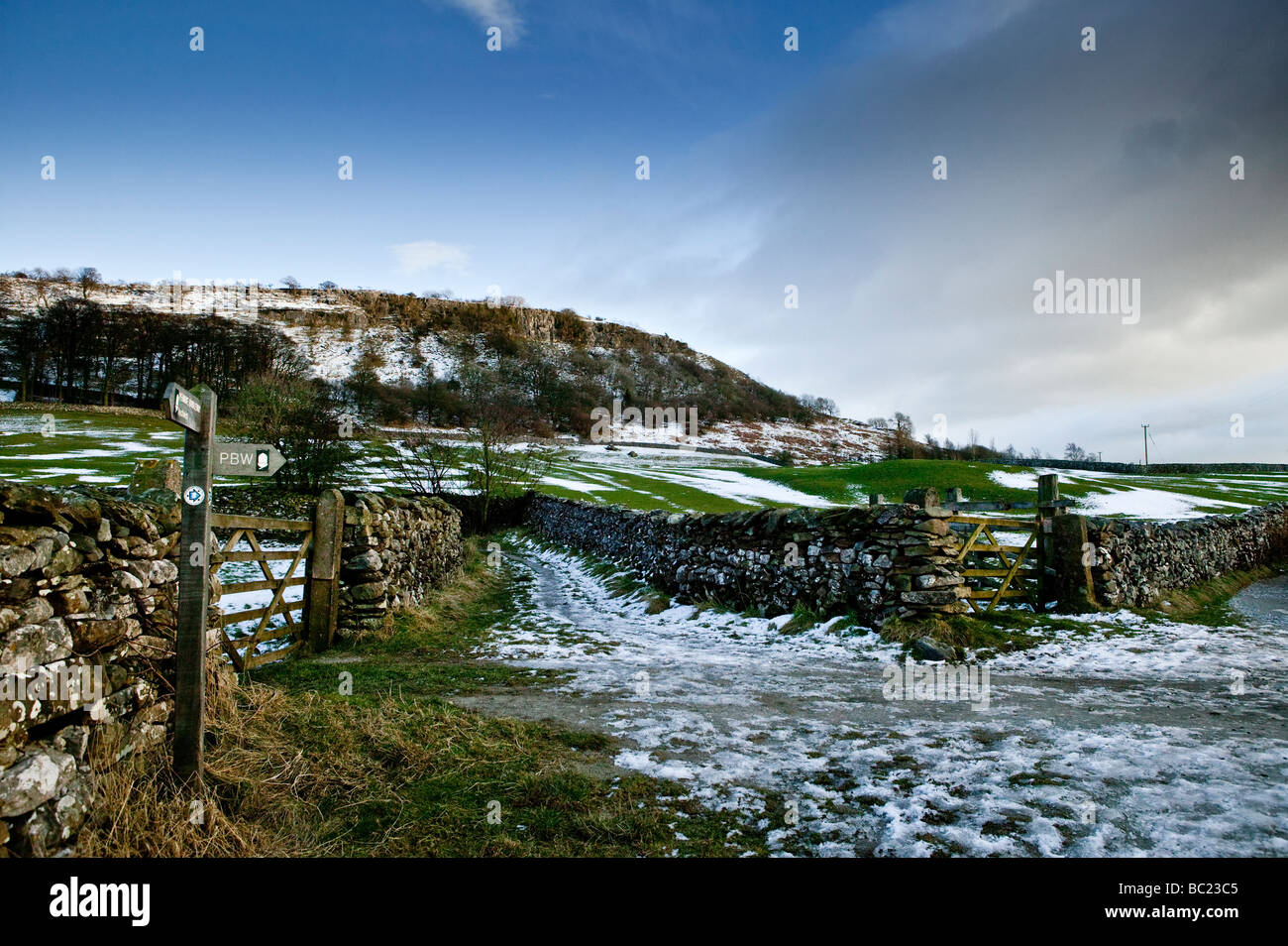 Bridleways and footpaths converge at the gates to fields in the Yorkshire Dales, near Austwick. Stock Photo