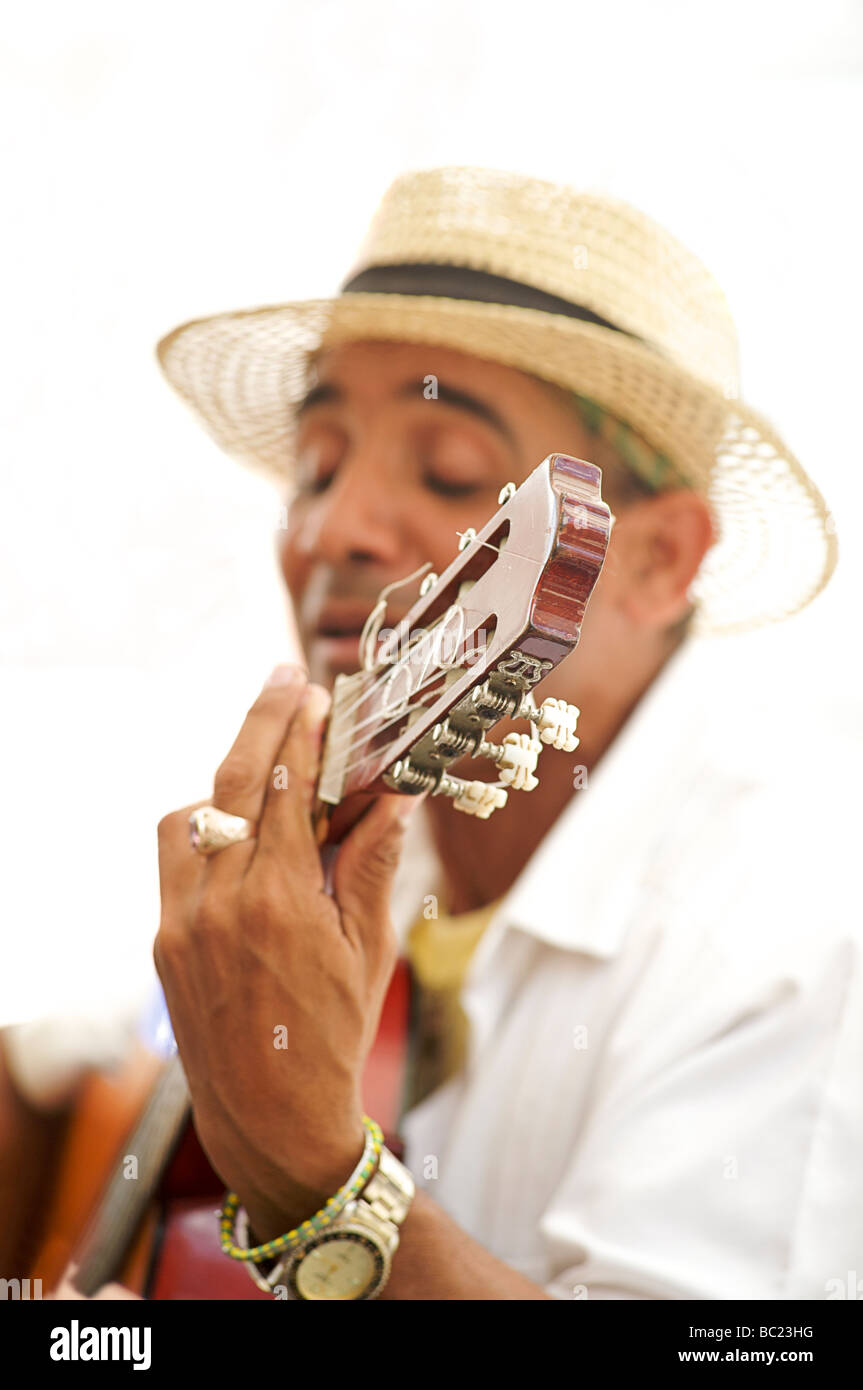 Cuban musician playing the guitar, Havana, Cuba Stock Photo