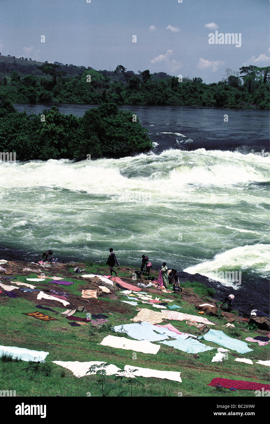 Washing spread on the ground to dry at side of River Nile Bujagali Falls Uganda East Africa Stock Photo