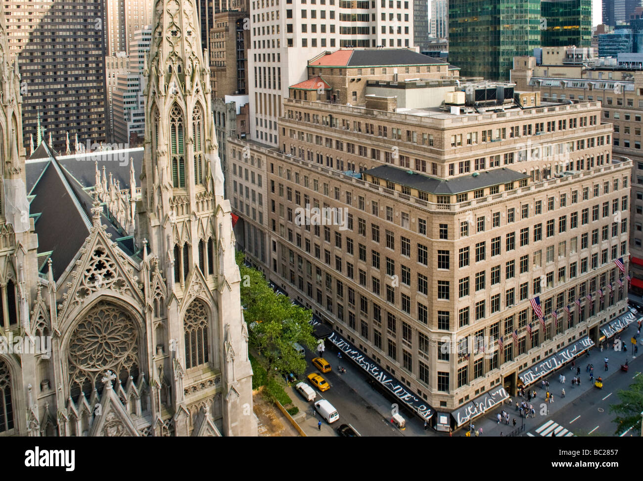 St .Patrick's Cathedral and Saks Fifth Avenue Department Store in New York City Stock Photo