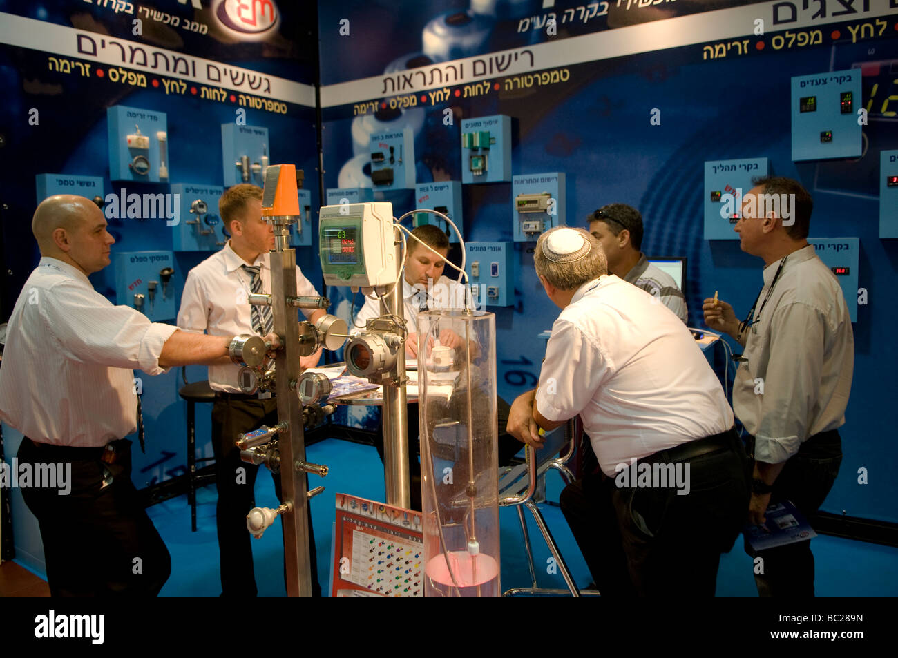 Salesmen of Elcon company which manufactures thermostatic valves at a technology exhibit in the Israel Trade Fairs & Convention Center in Tel Aviv Stock Photo