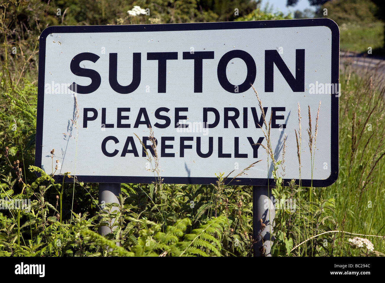 please-drive-carefully-village-sign-stock-photo-alamy