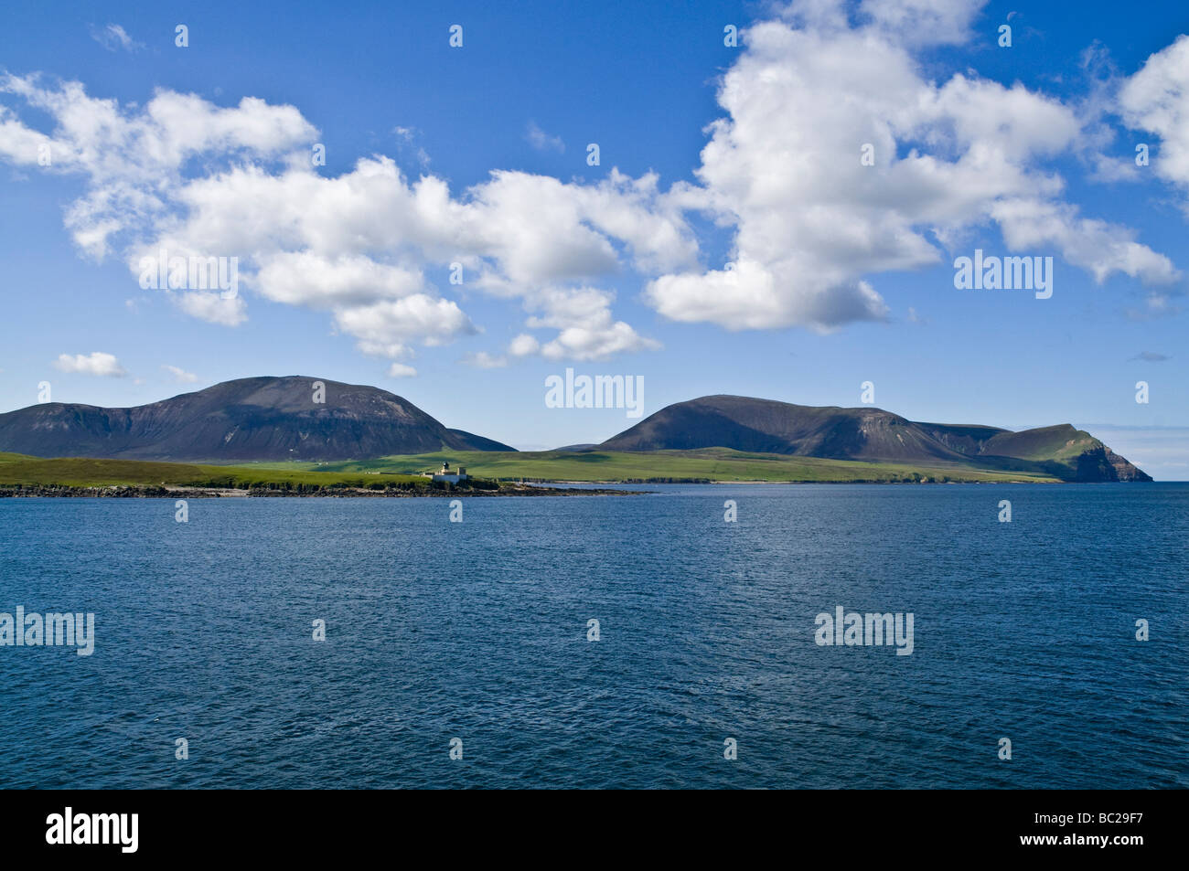 dh Graemsay HOY SOUND ORKNEY Oxan Point Low lighthouse Ward Hill Cuilags and Kame of Hoy scapa flow scottish islands orkneys sea coast Stock Photo