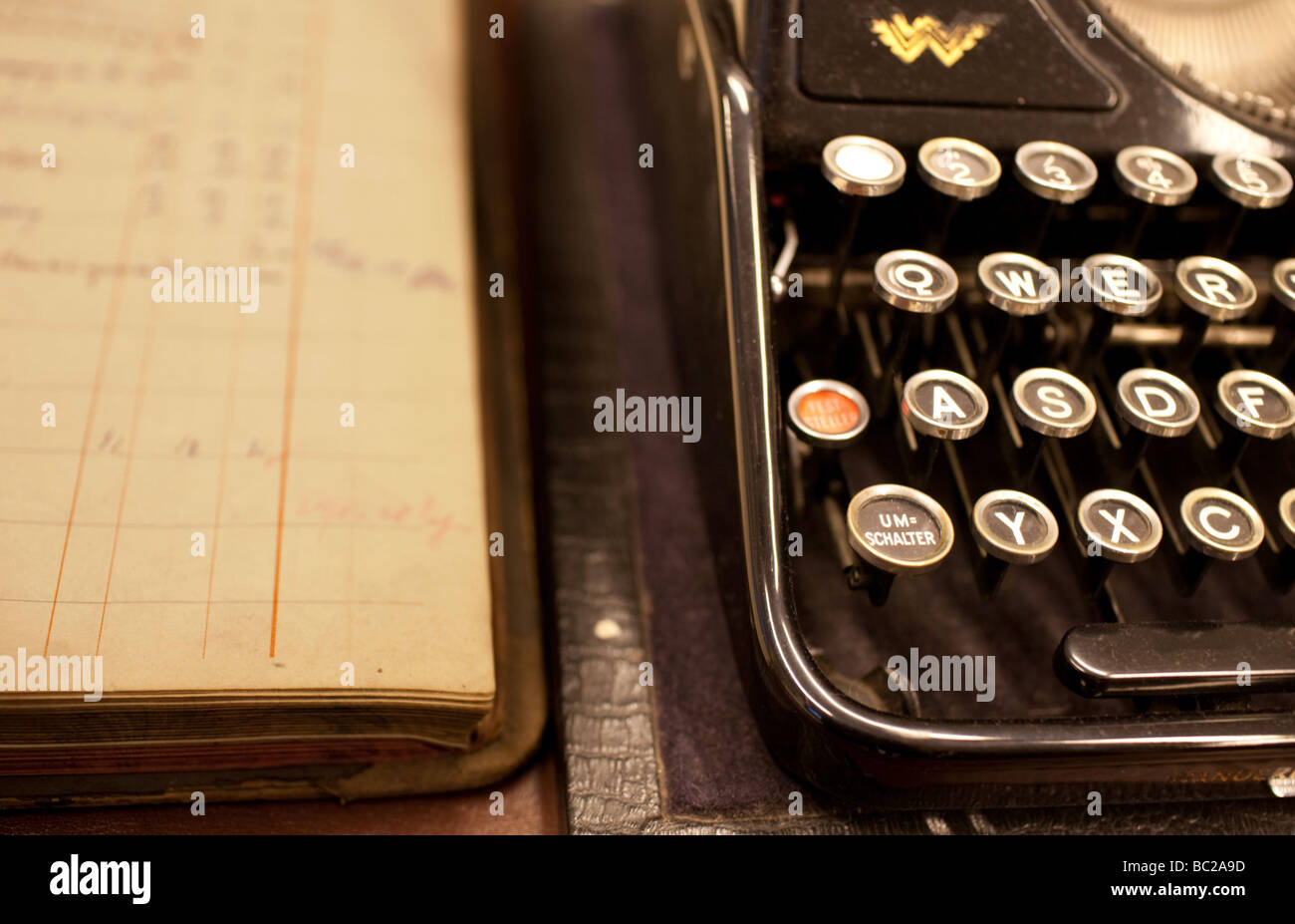 Typewriter and bank book Stock Photo