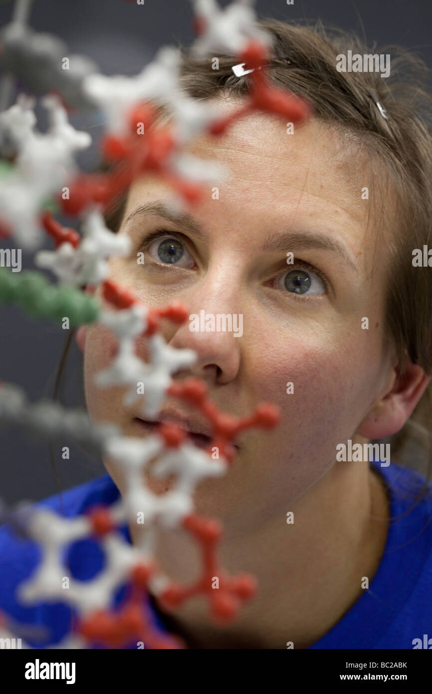 Student sitting behind a DNA Model at the Max Planck Institue at Berlin Stock Photo