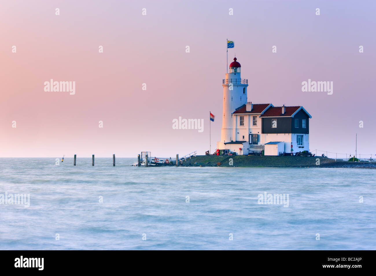 Sunrise Lighthouse Paard van Marken on Lake IJssel, close to Amsterdam, Netherlands Stock Photo