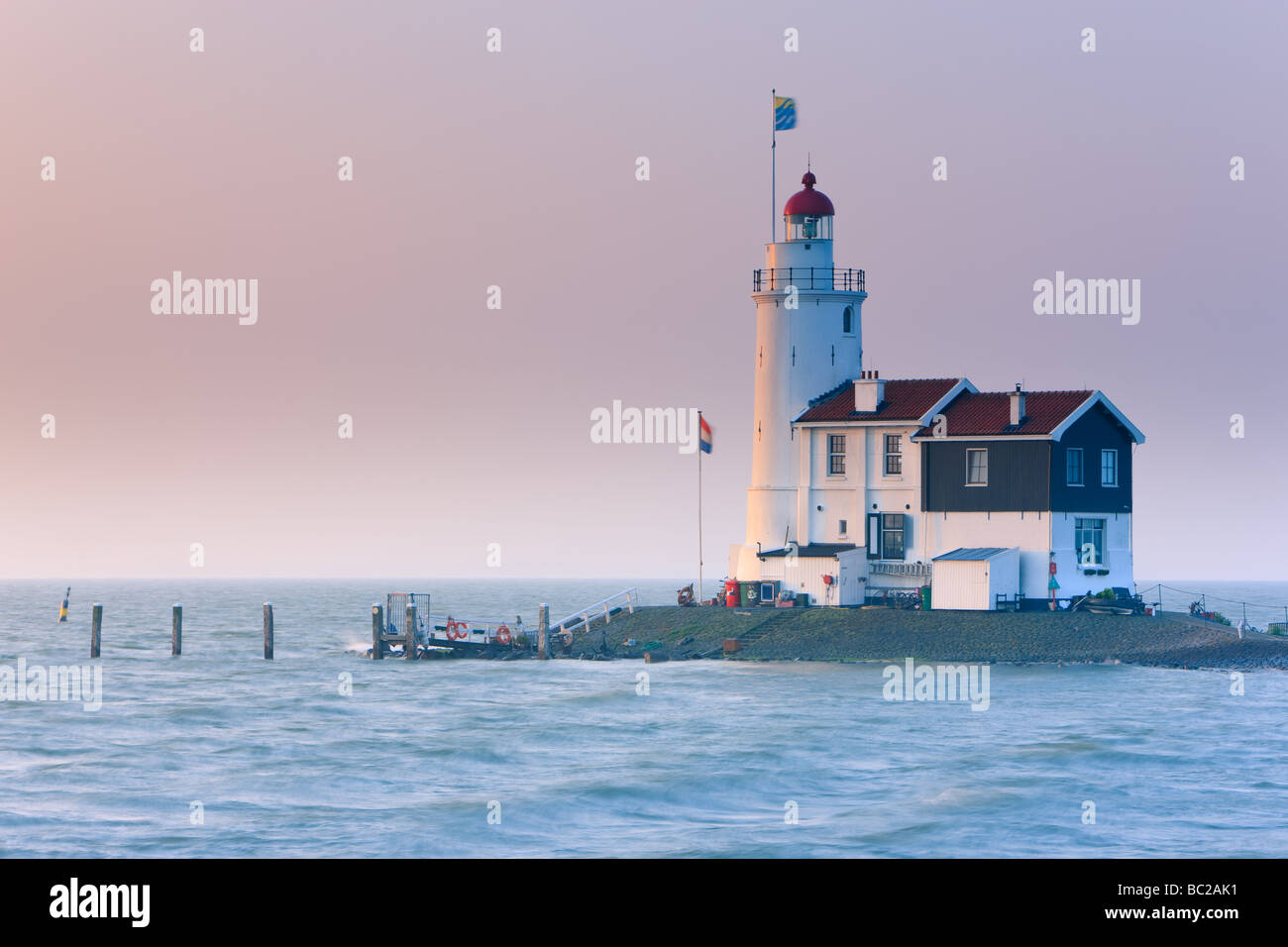 Sunrise Lighthouse Paard van Marken on Lake IJssel, close to Amsterdam, Netherlands Stock Photo