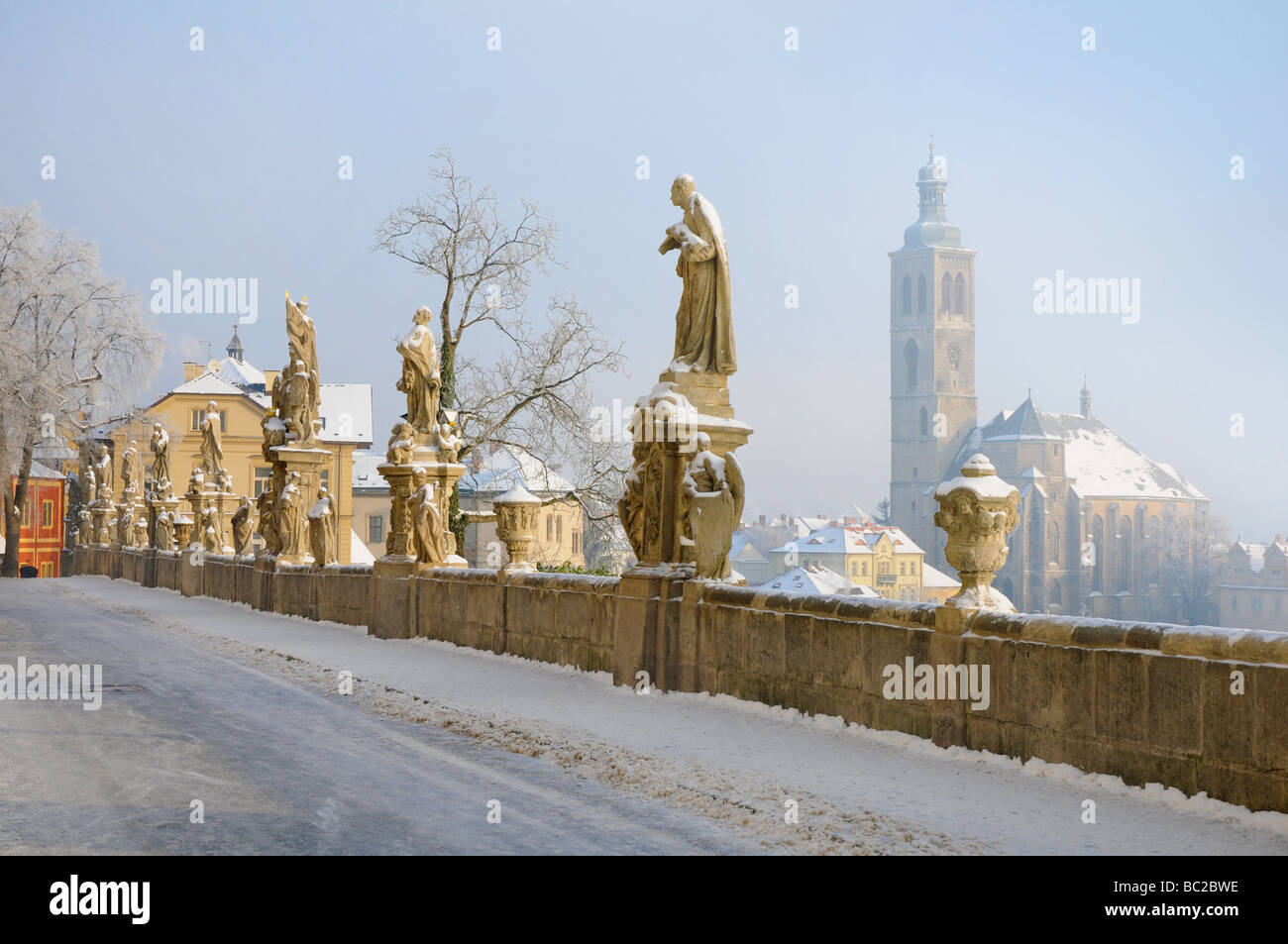 Kutná Hora in winter - bridge with Baroque statues in front of the Jesuit College Stock Photo