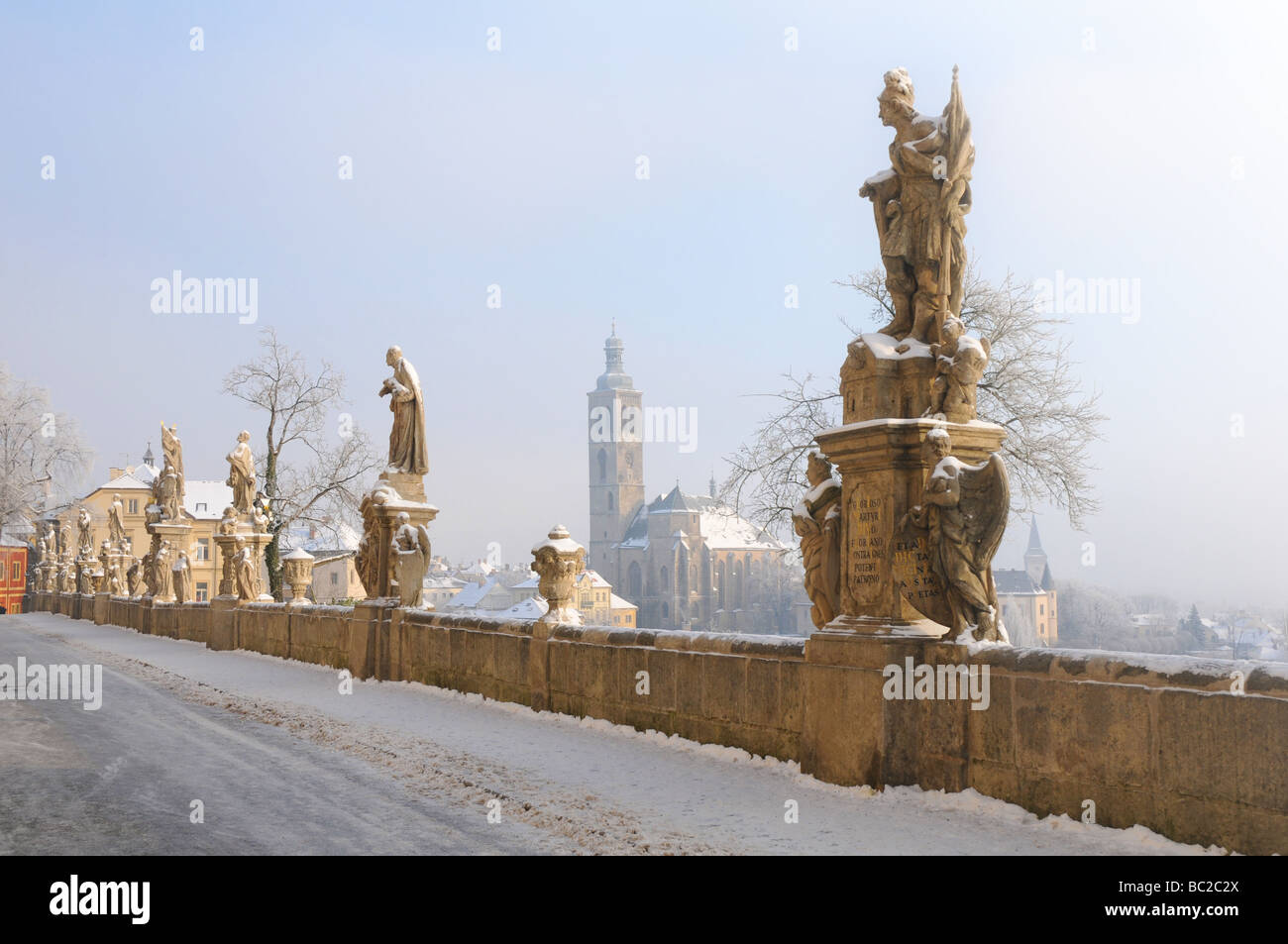 Kutná Hora in winter - bridge with Baroque statues in front of the Jesuit College Stock Photo