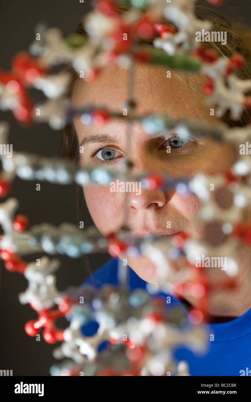 Student sitting behind a DNA Model at the Max Planck Institue at Berlin Stock Photo