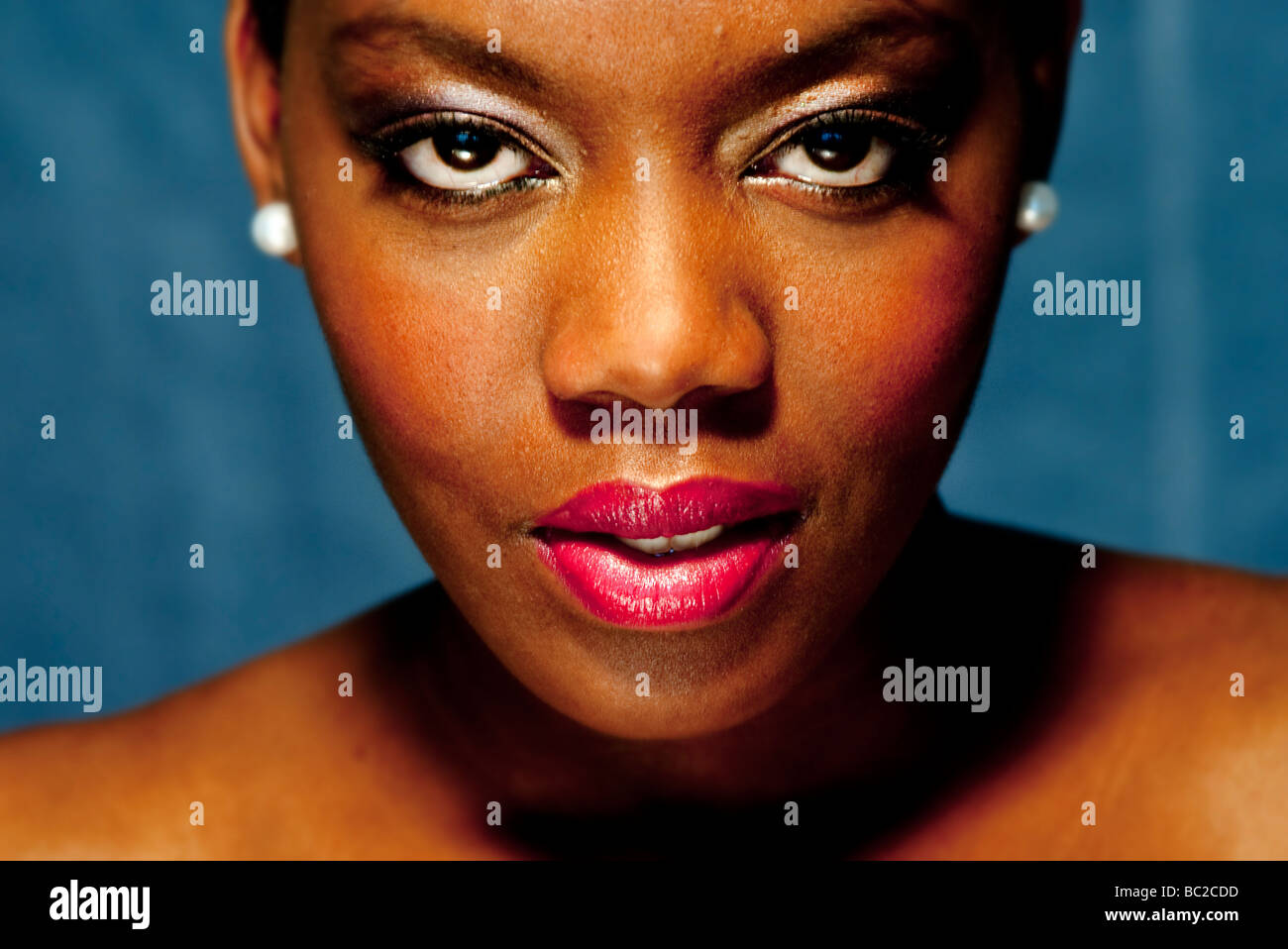 close up of a black woman wearing red lipstick Stock Photo