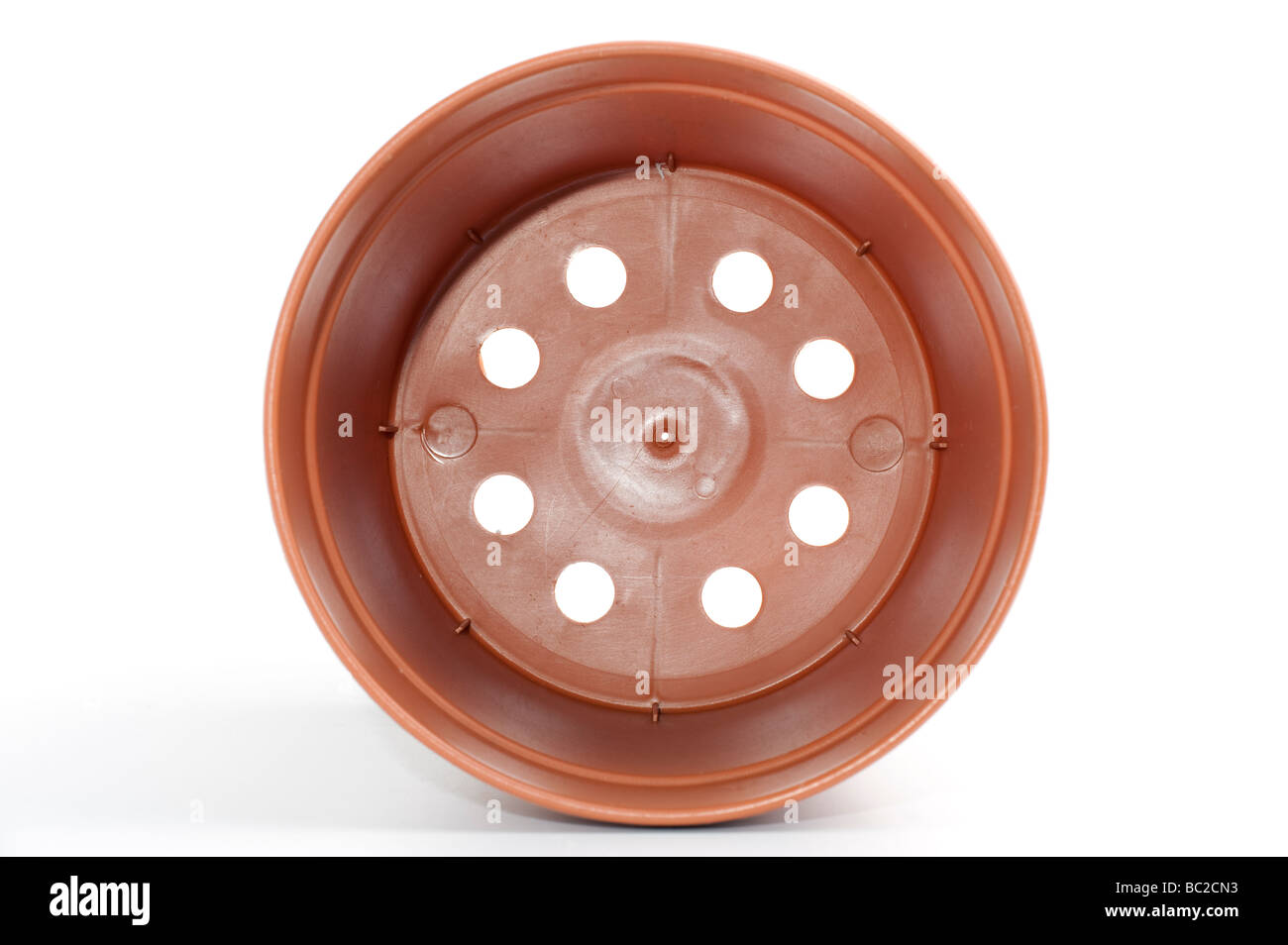 Inside of a brown plastic 'plant pot' container Stock Photo