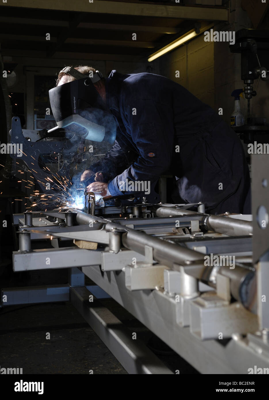 Man welding a car chassis Stock Photo Alamy