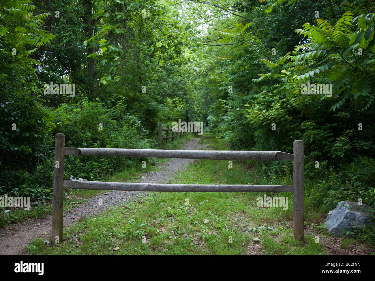 A fence blocking a trail Stock Photo - Alamy