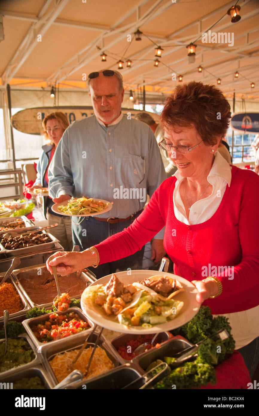 Sea Ray Club members making fish tacos at The Endless Summer bar cafe