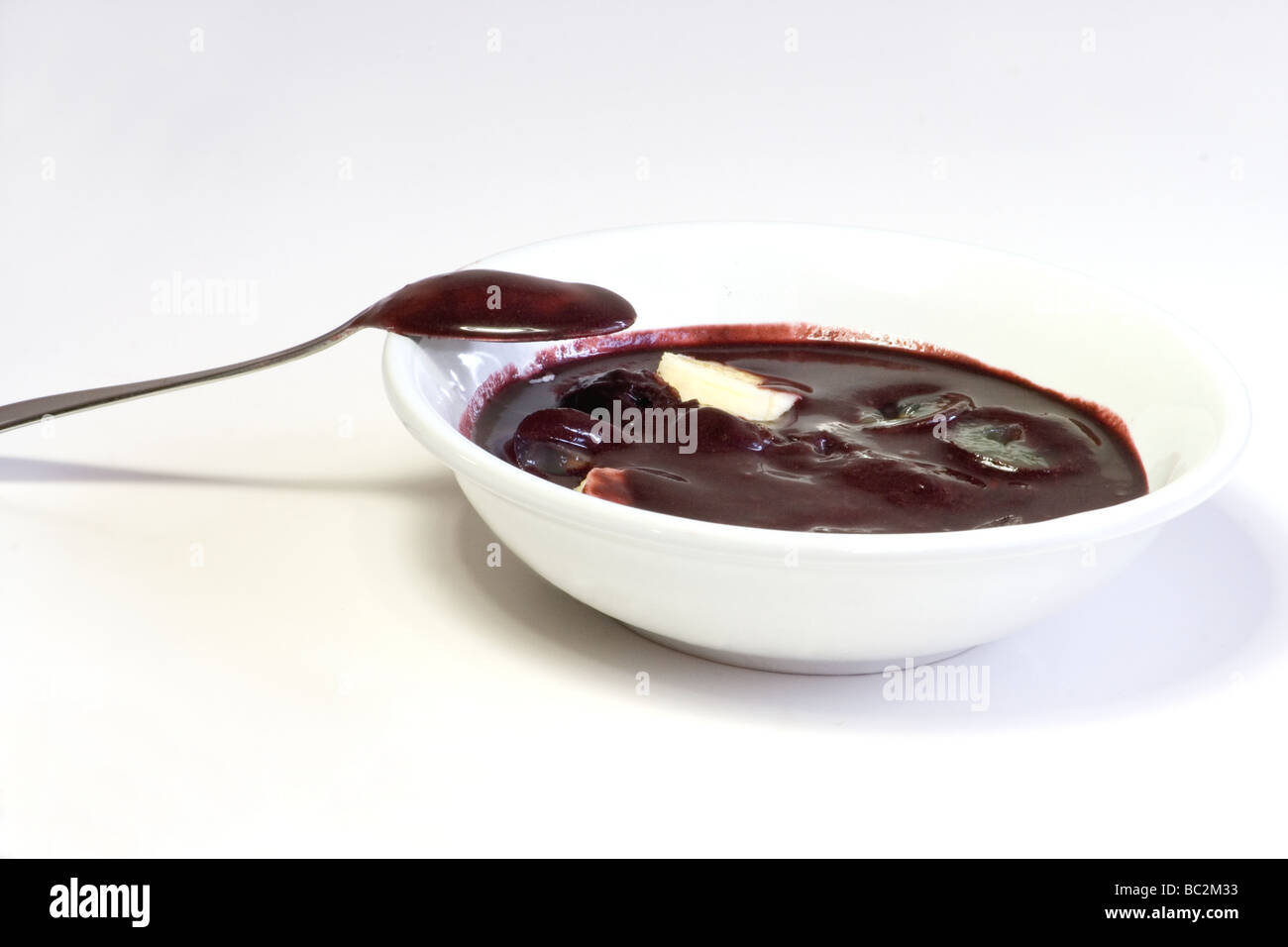 Close-uo of açai pulp served in a bowl with sliced banana Stock Photo