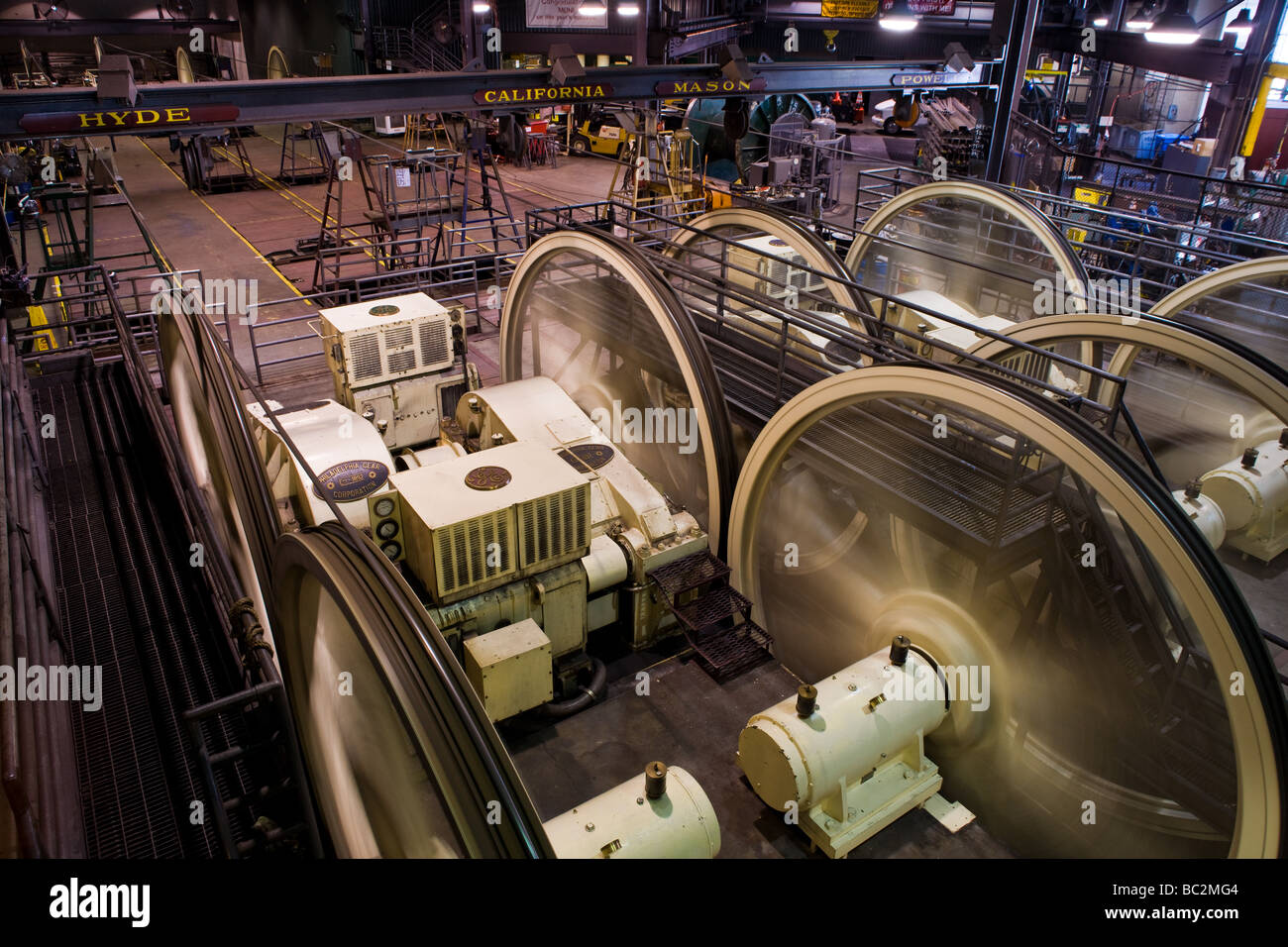 Large wheels turn in the San Francisco Cable Car Museum to operate the various cable car lines in the city. Stock Photo