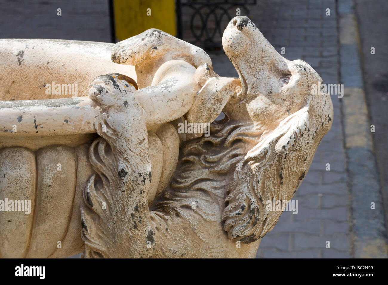 Water fountain with statue of thirsty dog trying to reach water, Red Sea coastal town, Egypt, North Africa Stock Photo