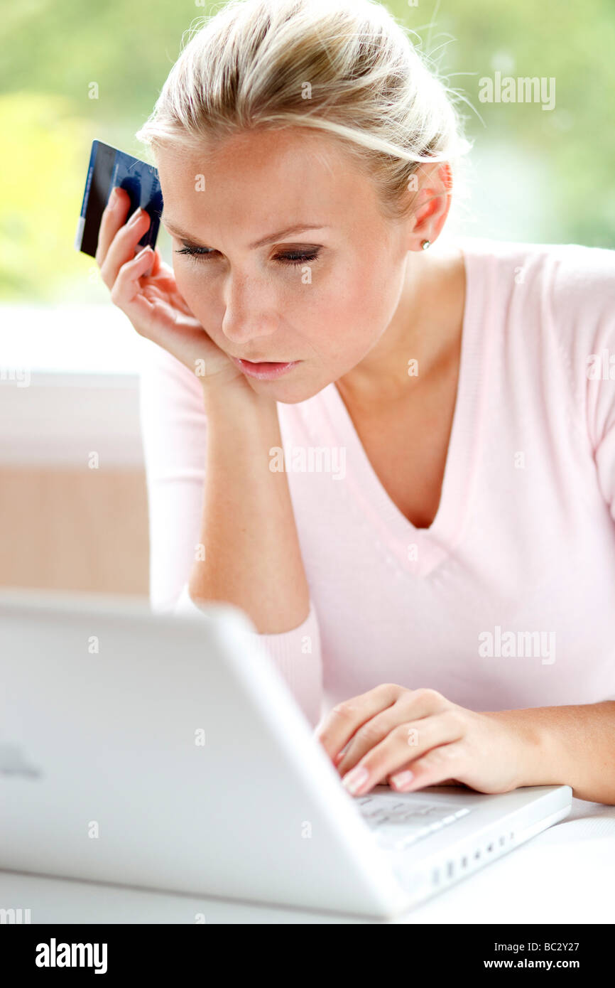 Woman using credit card online Stock Photo