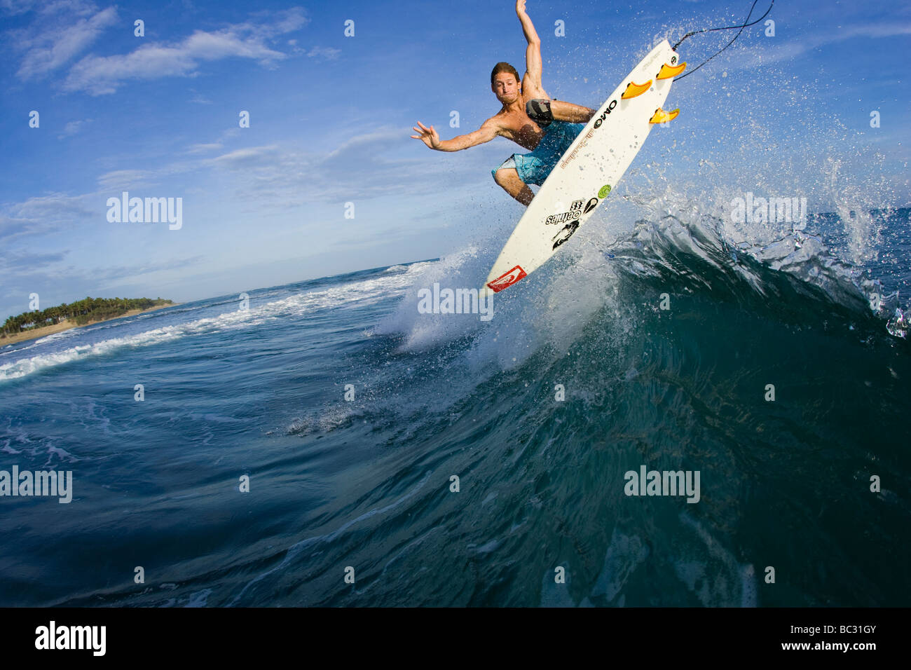 Water shot of surfer doing a frontside air in the Dominican. Stock Photo