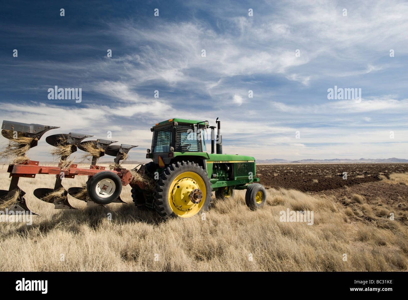 A Mennonite farmer plows under grassland in Chihuahua, Mexico. Stock Photo