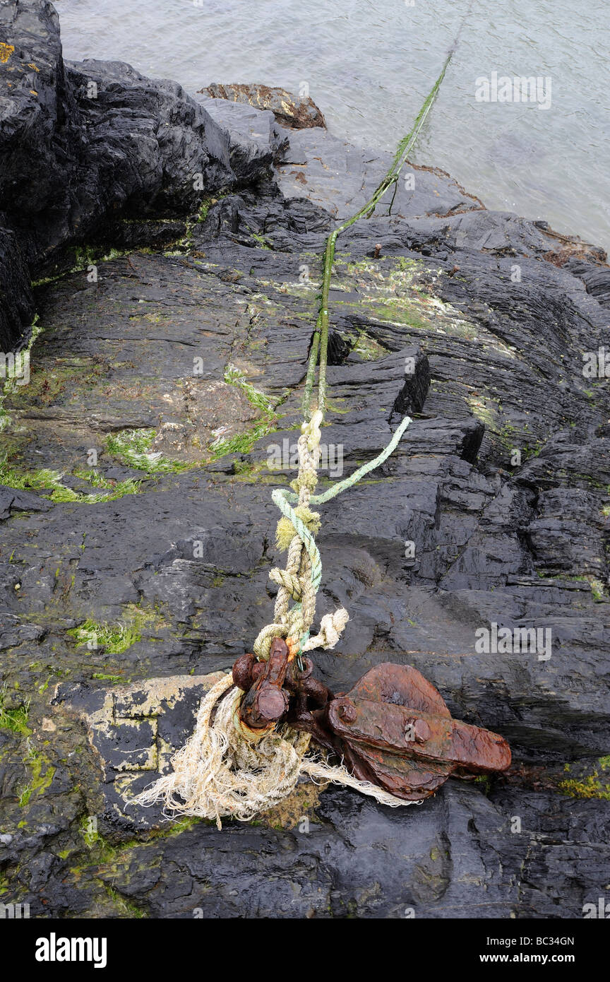 A rusty winch and boar mooring in Abercastle on the Pembrokeshire coast ...