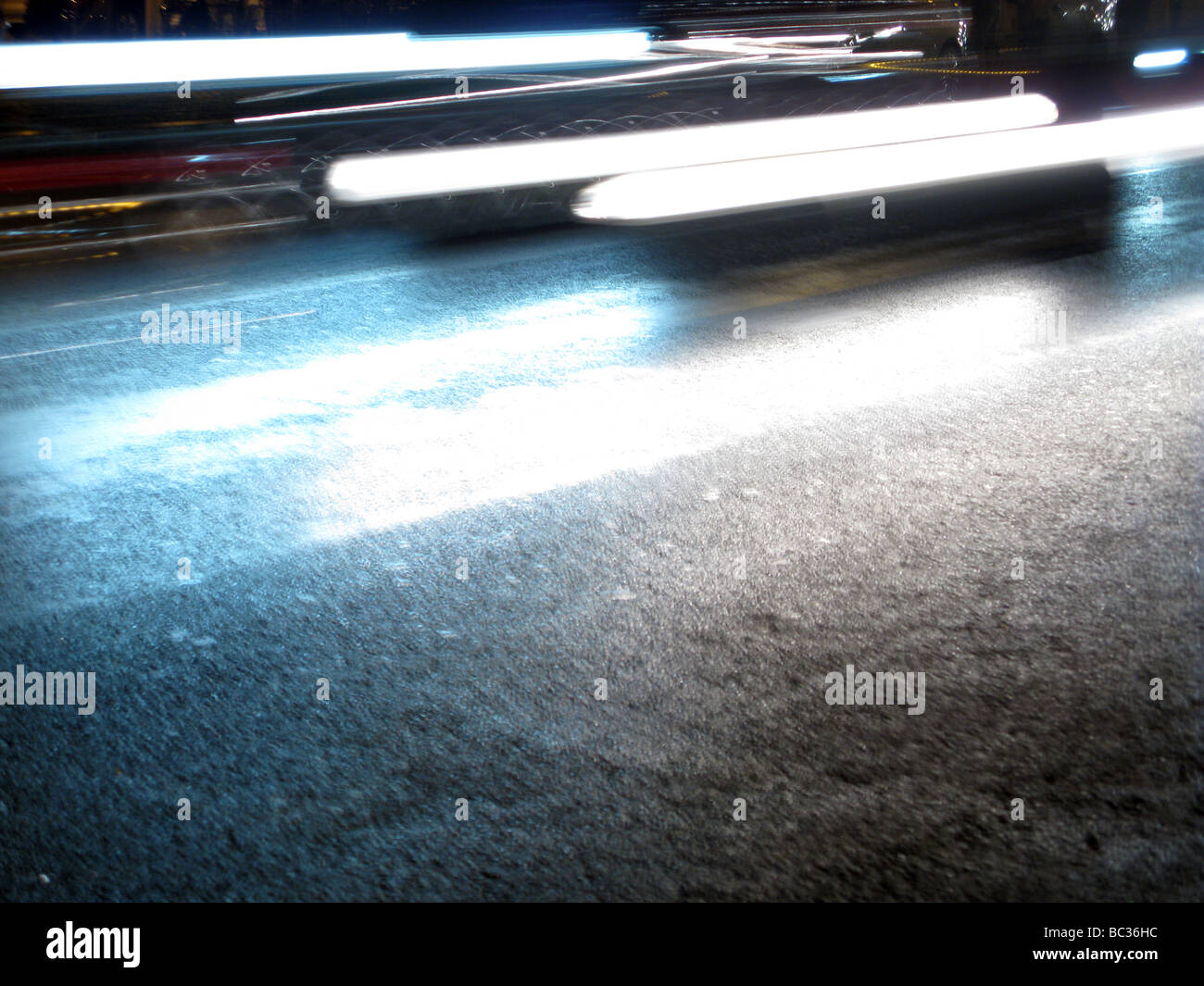 fast cars in dark street at night Stock Photo