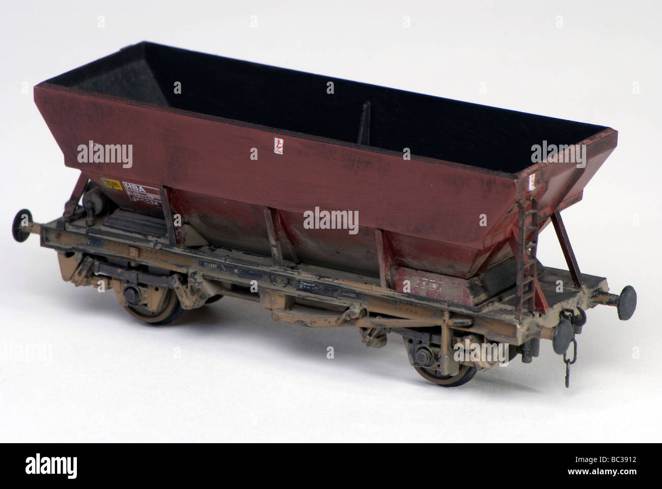 Weathered model railway coal or ballast wagon with realistic couplings